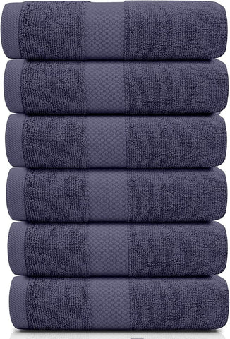 White Classic navy blue hotel collection towels rolled in display.