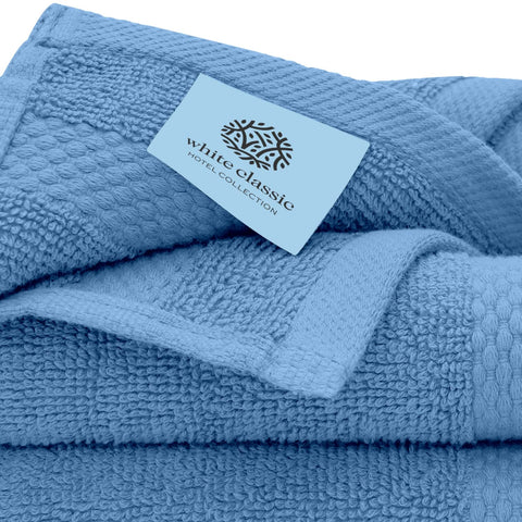 White Classic hotel spa setup with washcloths for luxurious routine.