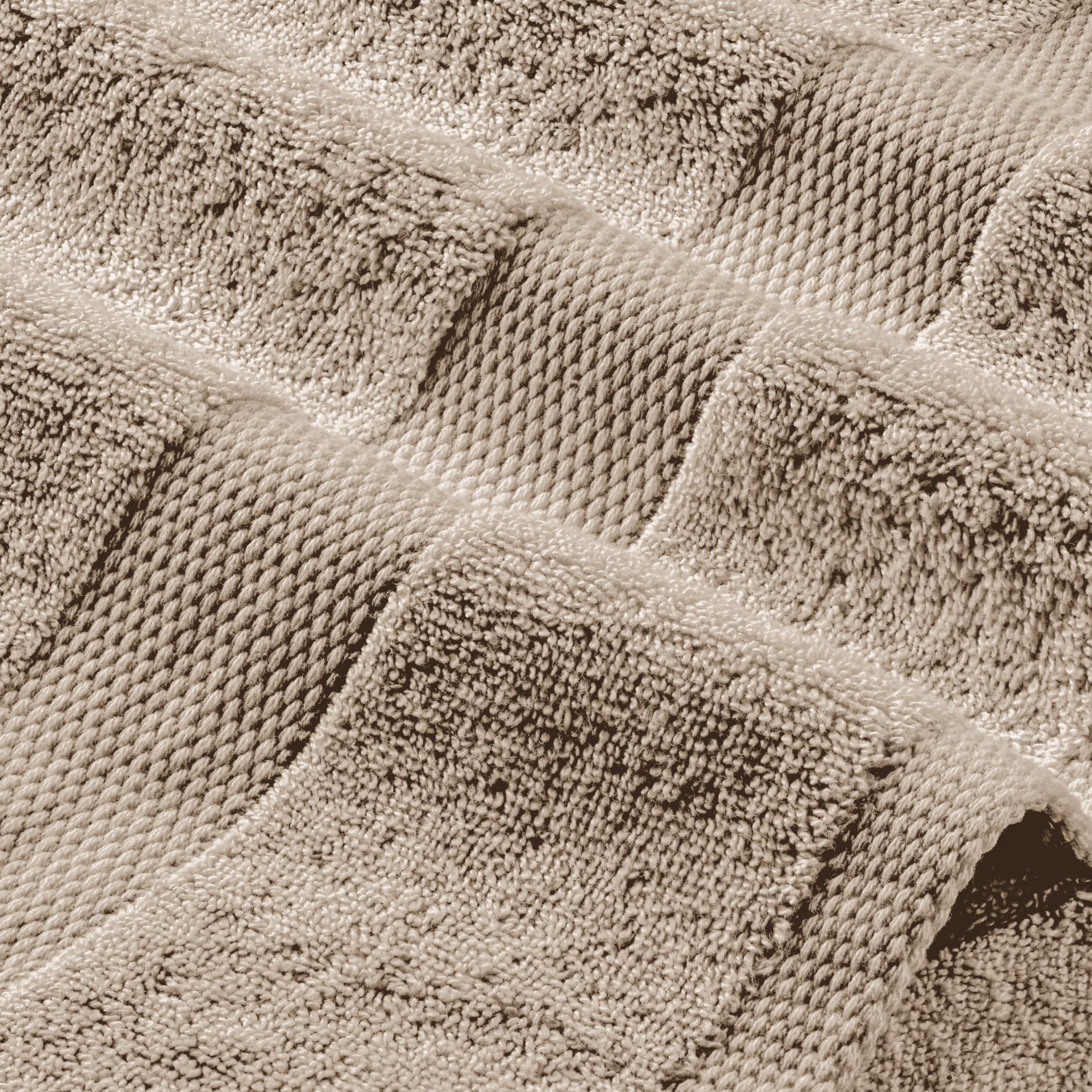 White Classic Wealuxe taupe towel air-drying scene emphasizes soft touch and absorbency.