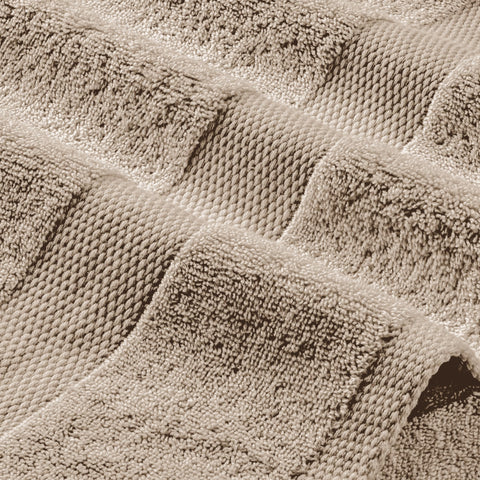 White Classic Wealuxe taupe towel air-drying scene emphasizes soft touch and absorbency.