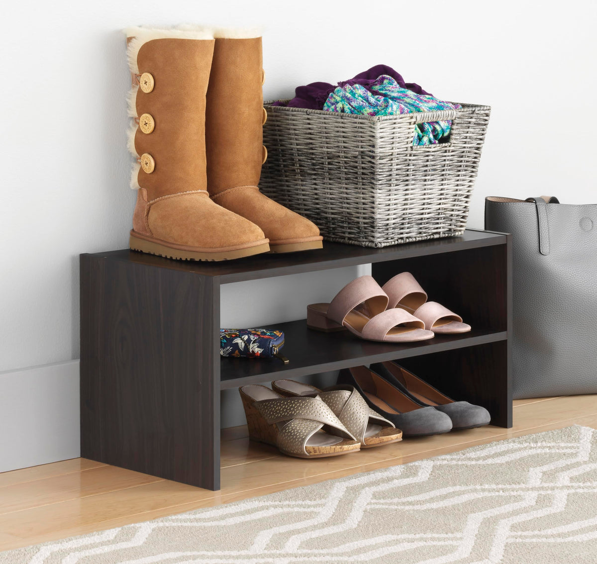 Whitmor wood stackable 2-shelf shoe rack front view stores nine pairs neatly.
