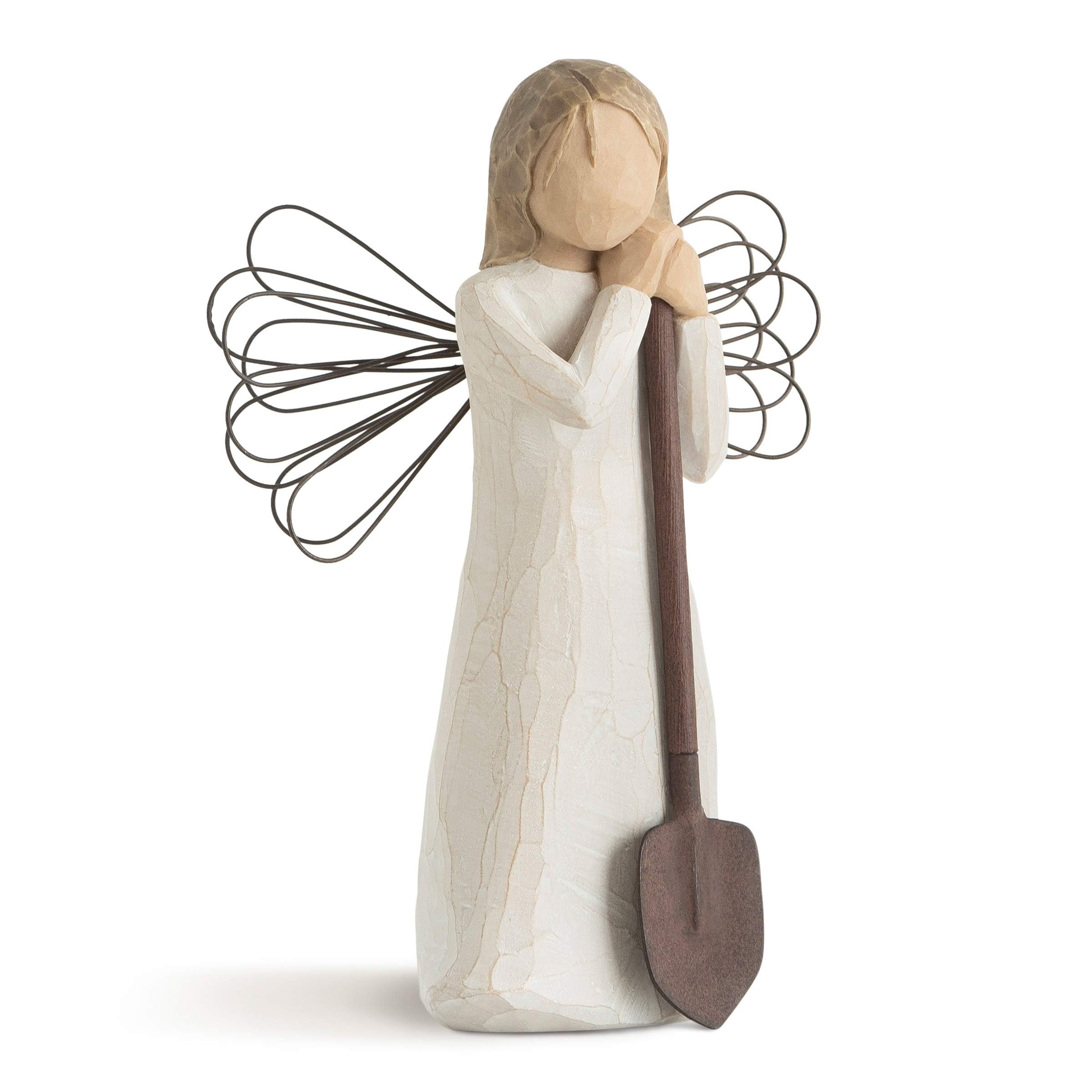 Willow Tree angel garden figurine in cream dress stands as a garden decor piece