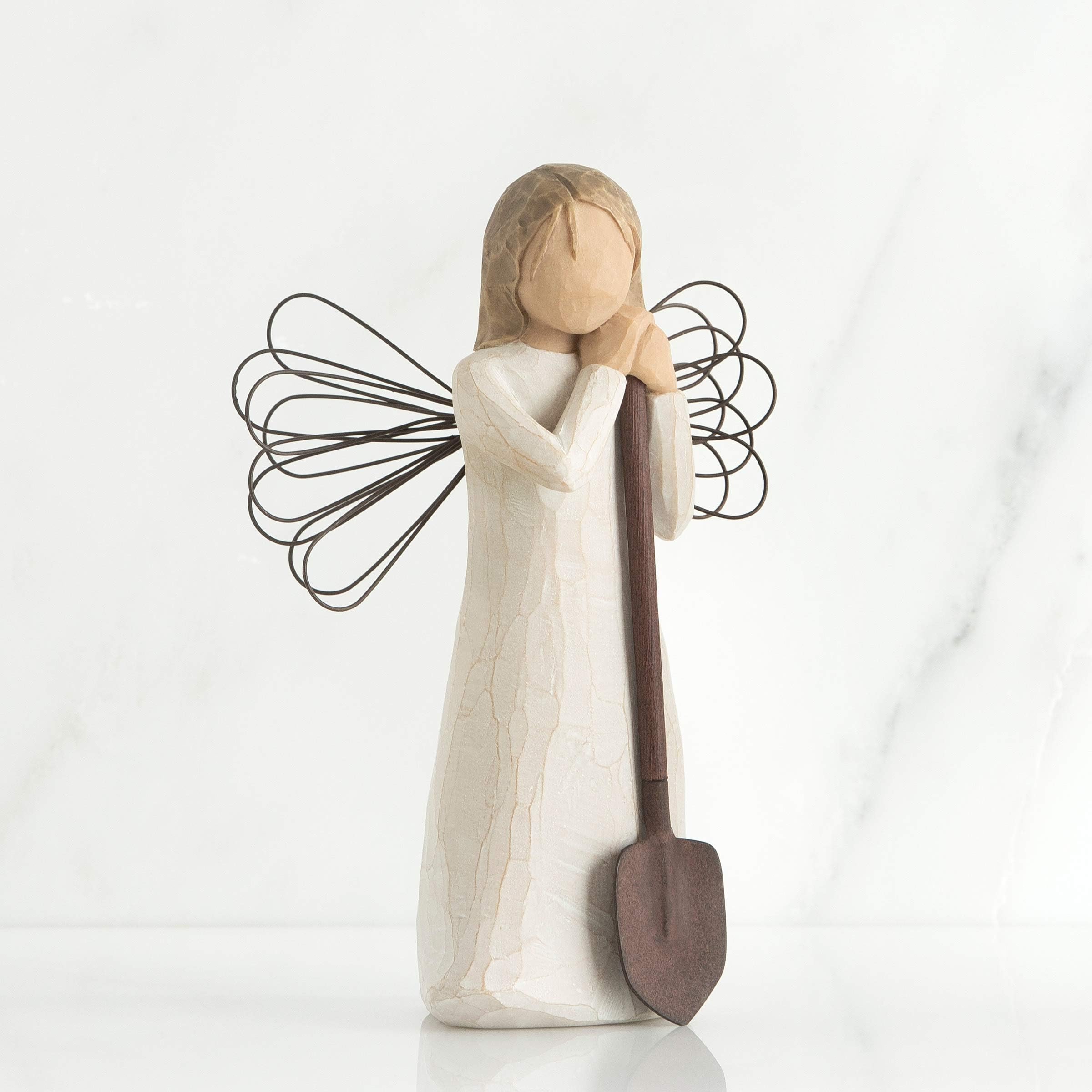 Willow Tree angel garden figure holding a shovel adds gardener charm