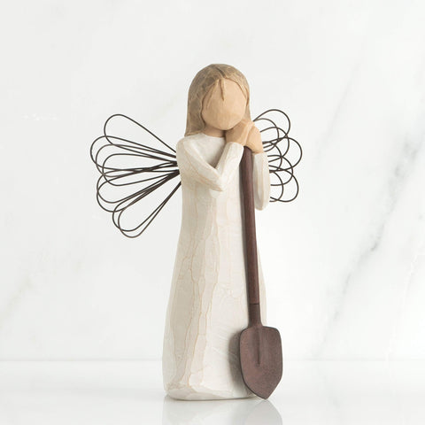 Willow Tree angel garden figure holding a shovel adds gardener charm