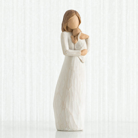 Willow Tree Angel of Mine hand-painted resin figure enhancing shelf display.