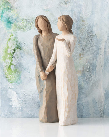 Willow Tree artist Susan Lordi hand-carves and paints each original design.