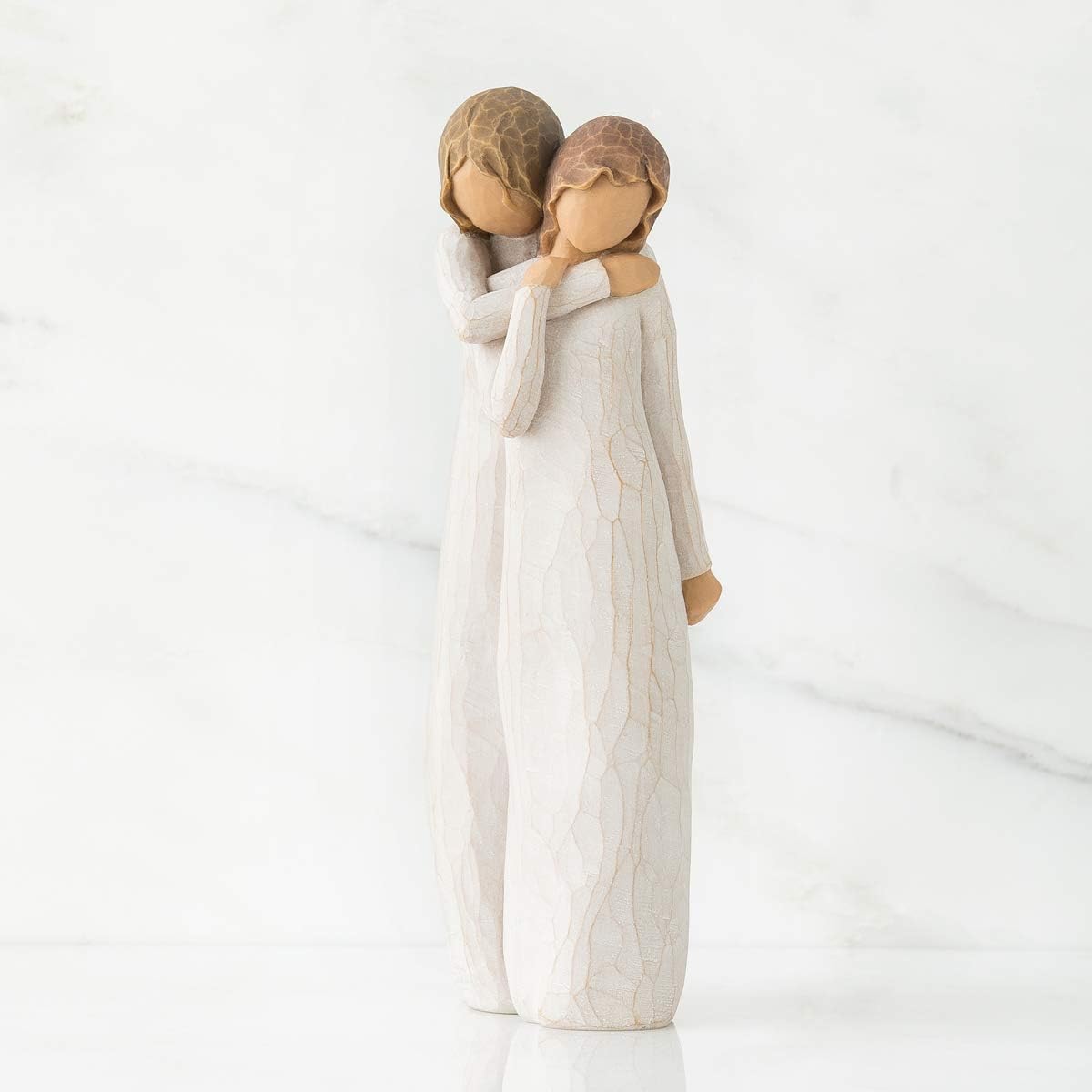 Willow Tree Chrysalis embracing pose side view highlights supportive friendship.
