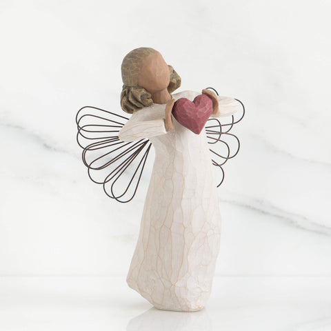 Willow Tree darker-skin angel close-up, highlighting texture and serene expression for display.