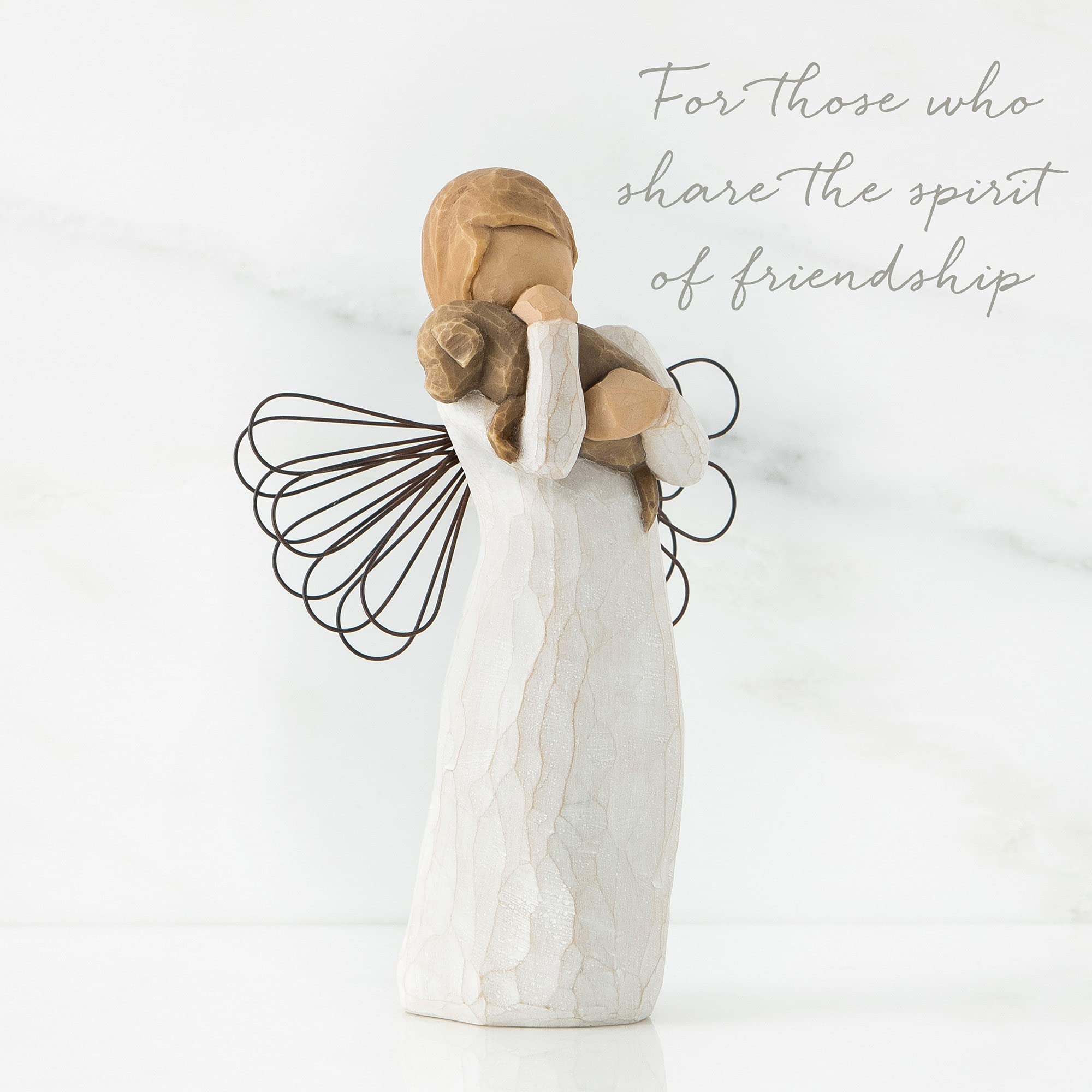 Willow Tree angel displayed on shelf or mantel.