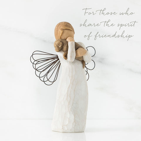 Willow Tree angel displayed on shelf or mantel.