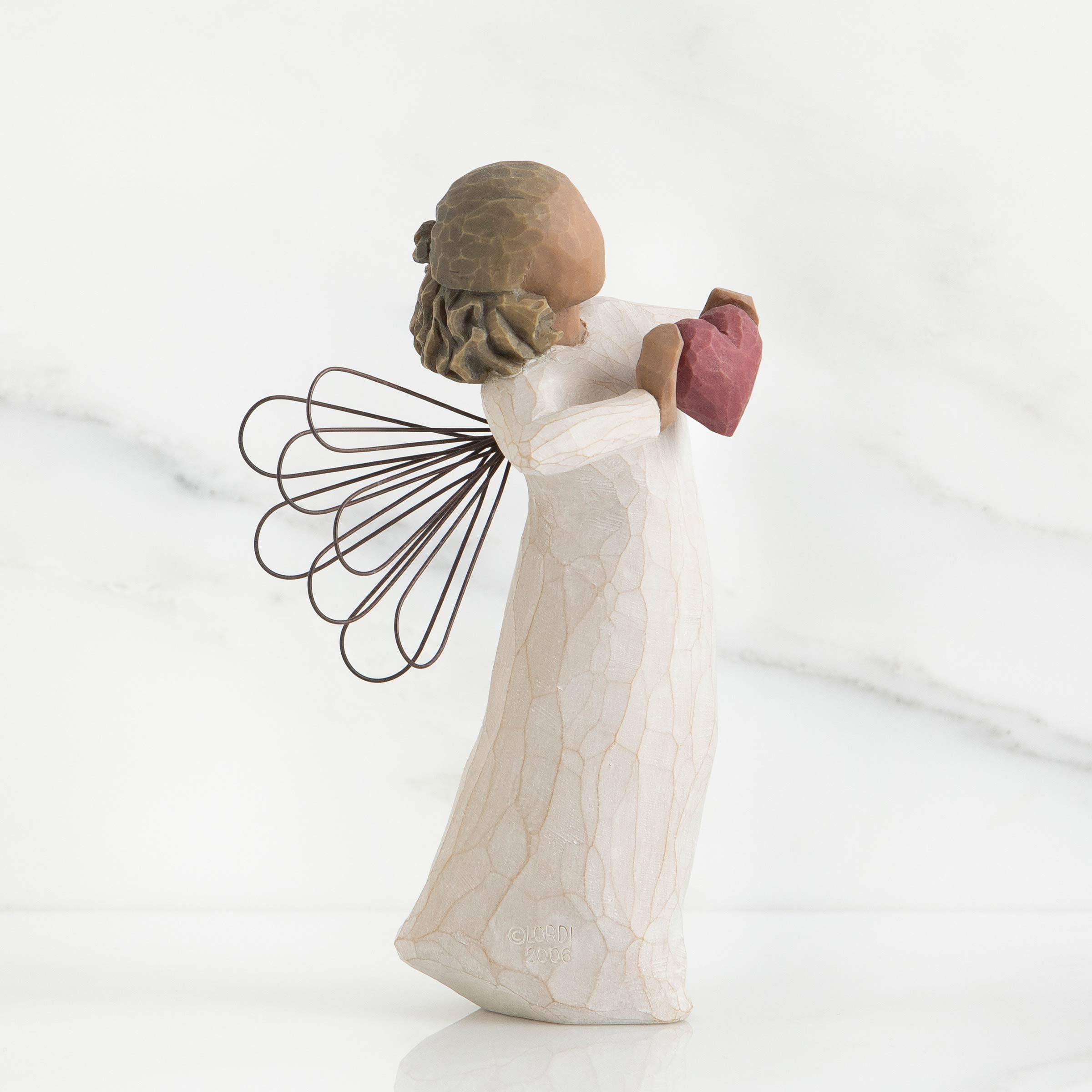 Willow Tree enclosure card reads 'You are loved', visible on the giftable figure.
