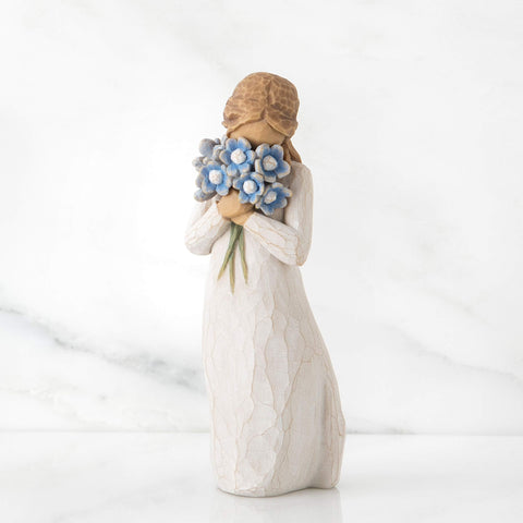 Willow Tree Forget-me-not figure side view highlighting cream dress and floral bouquet.