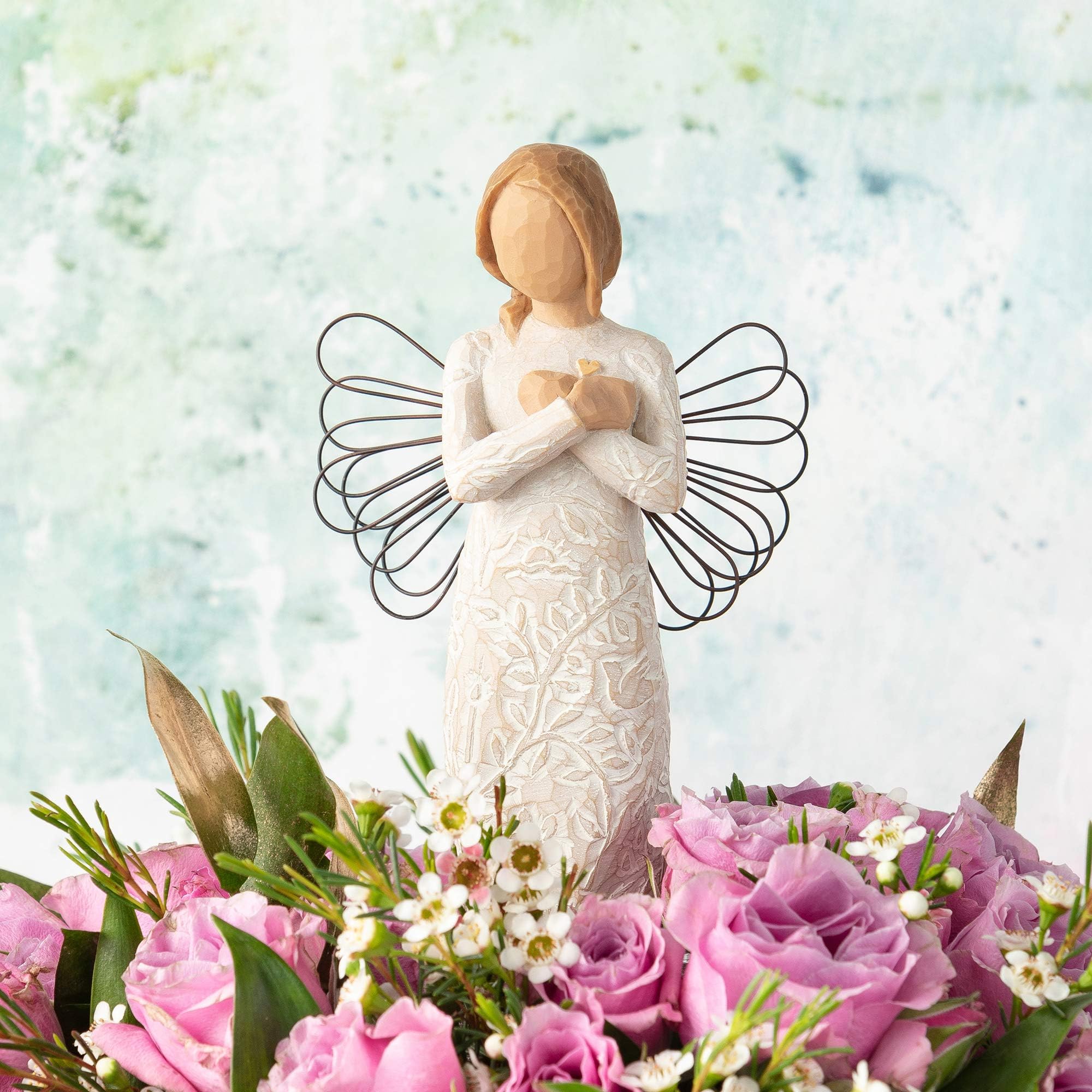 Hand-painted resin angel from Willow Tree, preserving Susan Lordi's artistry.