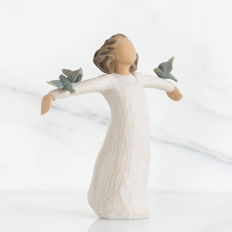 Willow Tree Happiness figure in cream dress showing hand-painted details.