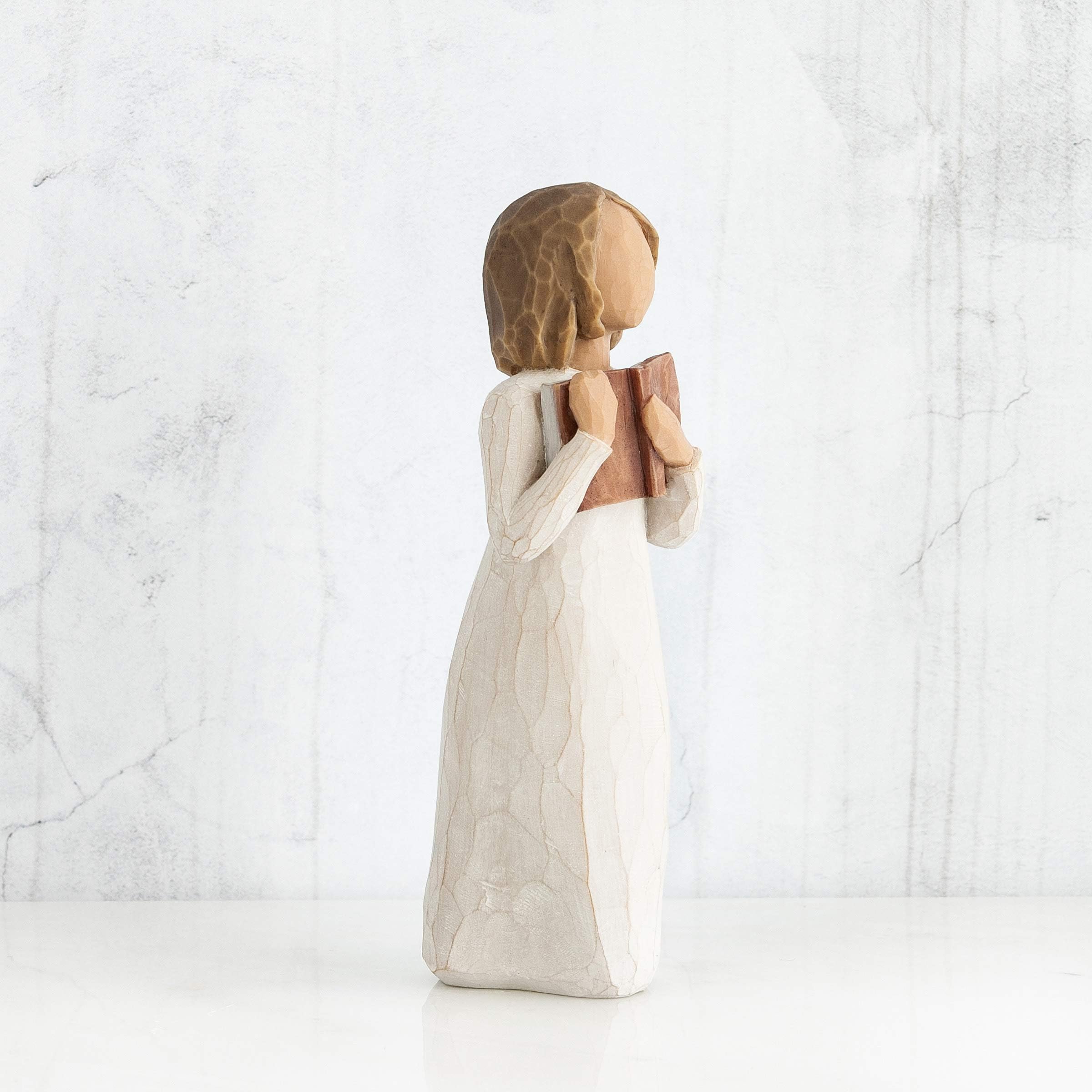 Hand-painted resin detail showcases artisan craftsmanship on Willow Tree Love of Learning sculpture