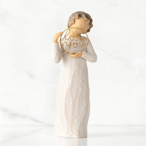 Close-up of hand-painted detailing on the cream dress.