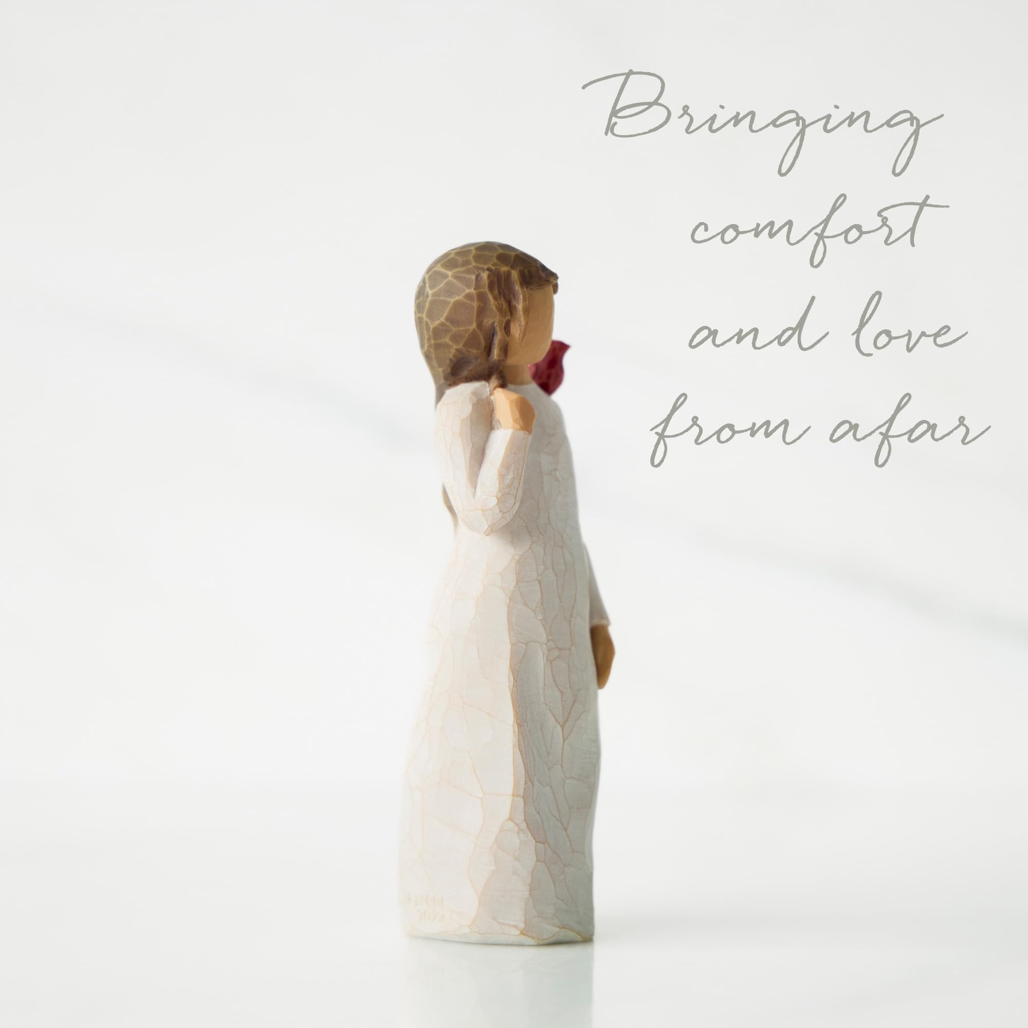 Willow Tree Messenger standing figure with cardinal on shoulder adds warmth to any shelf.
