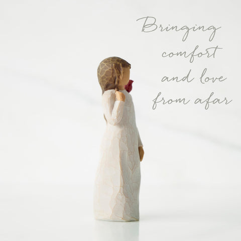 Willow Tree Messenger standing figure with cardinal on shoulder adds warmth to any shelf.