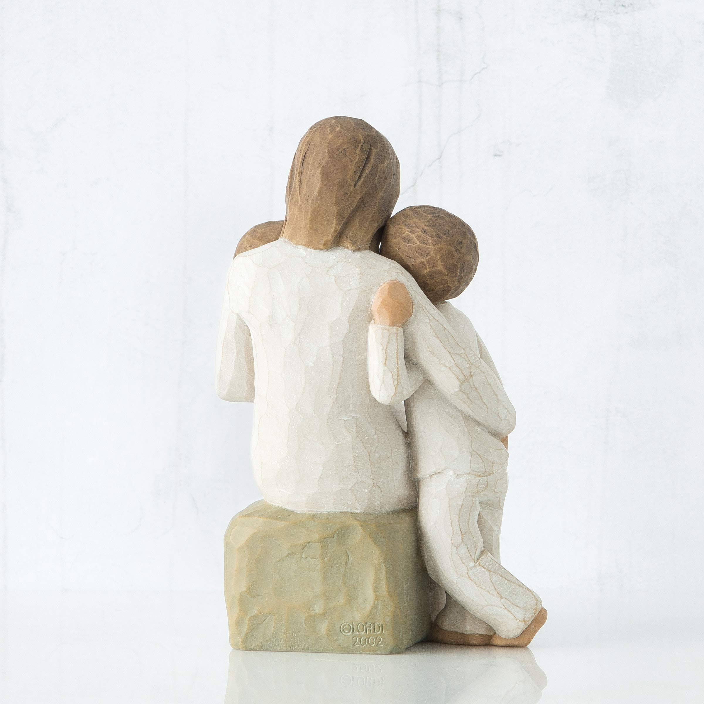 Willow Tree Quietly arm holding toddler highlights nurturing moment