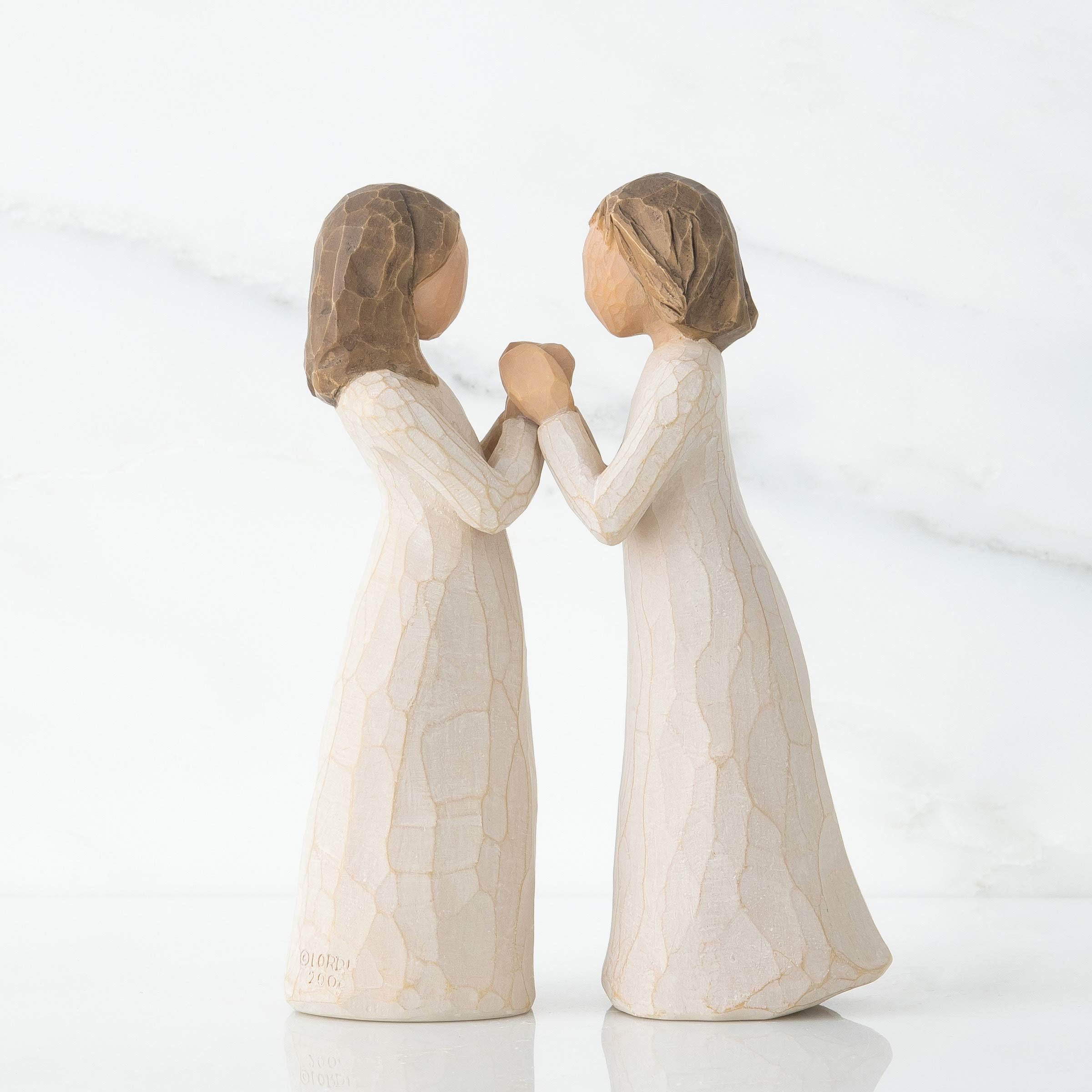 Willow Tree Sisters by Heart cream dress detail with hand-painted charm for home décor and gifting.