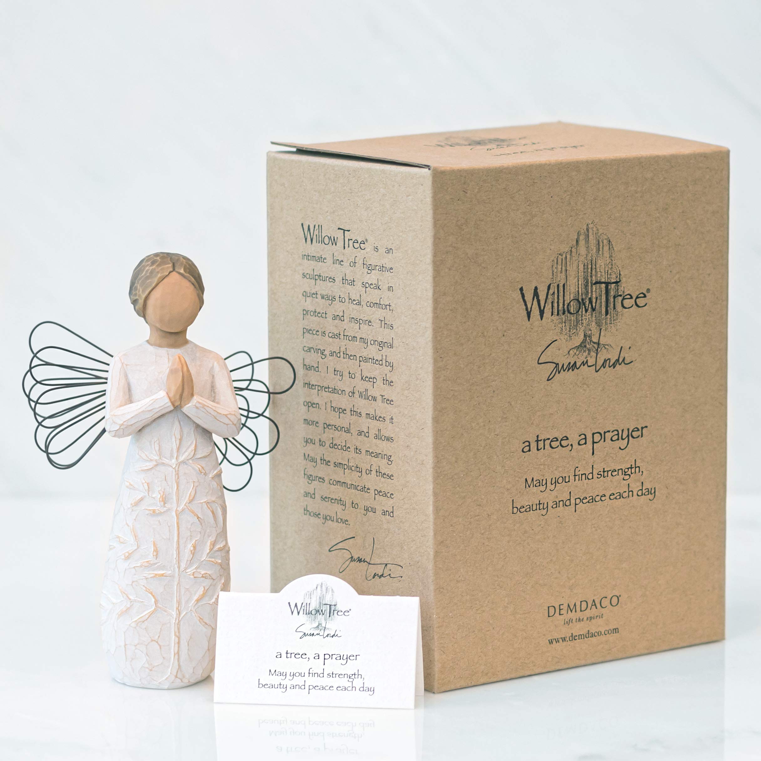 Willow Tree tree carving on dress adds subtle spiritual detail to displays