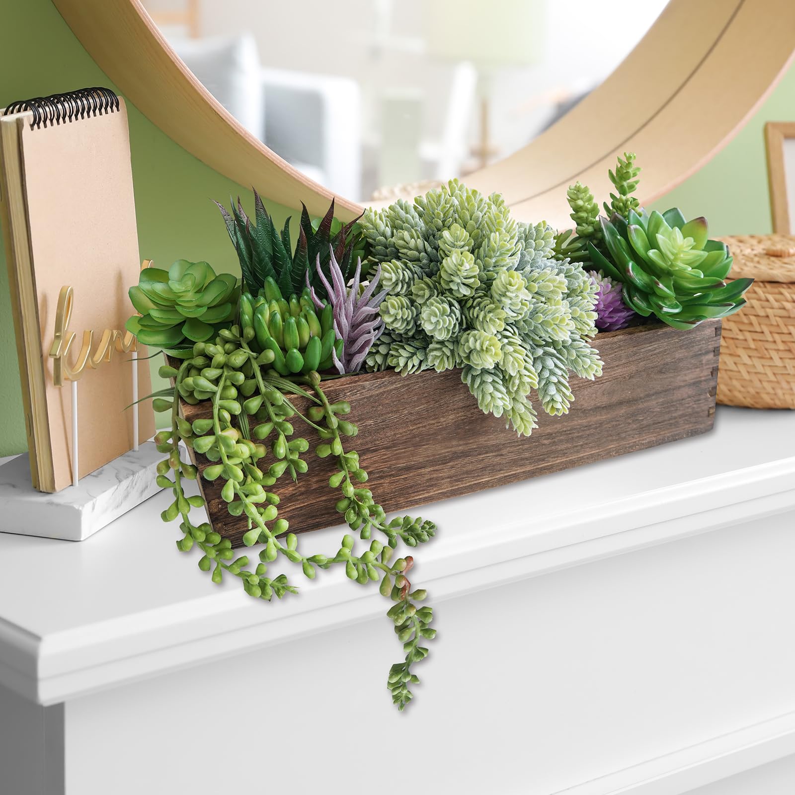 Winlyn wedding table decor with succulent centerpiece and candles.