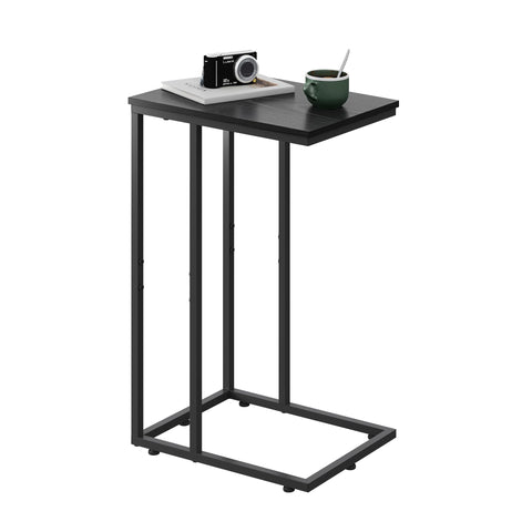 WLIVE black C-shaped side table beside bed for easy access