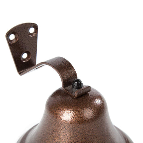 WMM Pub dining copper bell welcoming patrons with nostalgic tone.