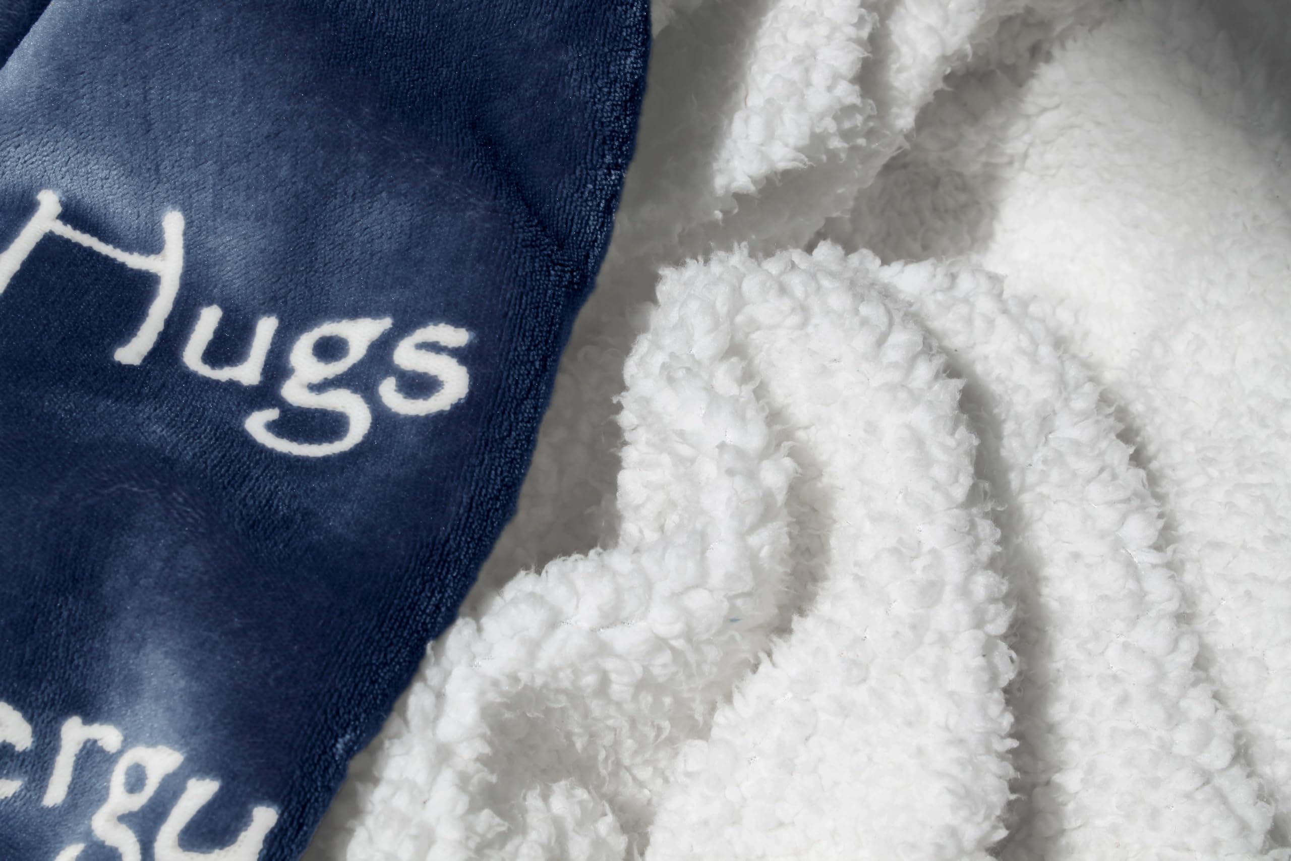 Wolf Creek Blanket on a blue sofa for cozy evenings.