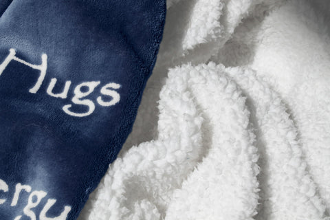 Wolf Creek Blanket on a blue sofa for cozy evenings.