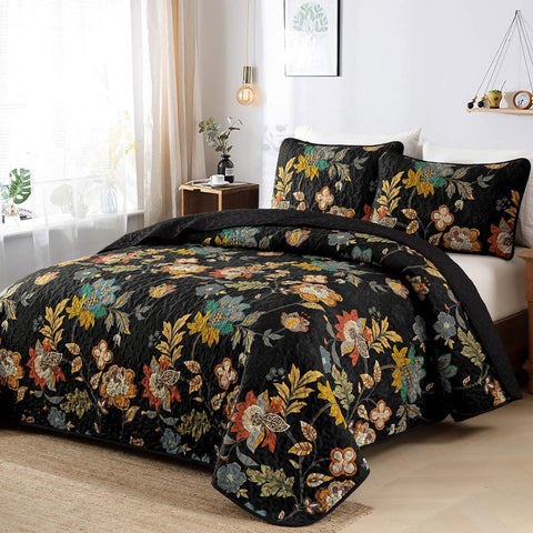 WONGS BEDDING black botanical quilt highlights leaf motifs on a dark backdrop for versatile bedside décor.