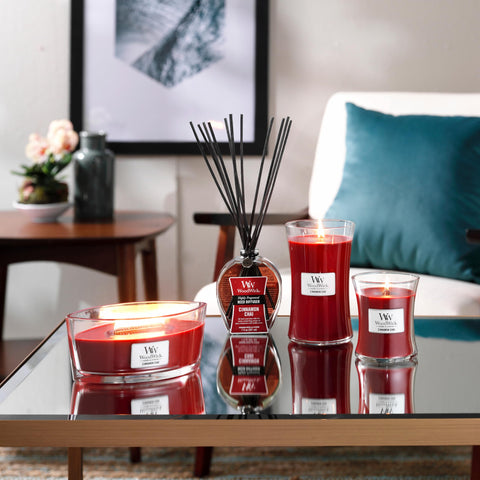 WoodWick Cinnamon Chai candle on a decorative shelf for decor