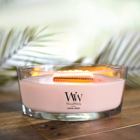 WoodWick Coastal Sunset Ellipse crackling wick creates cozy fireplace ambiance.