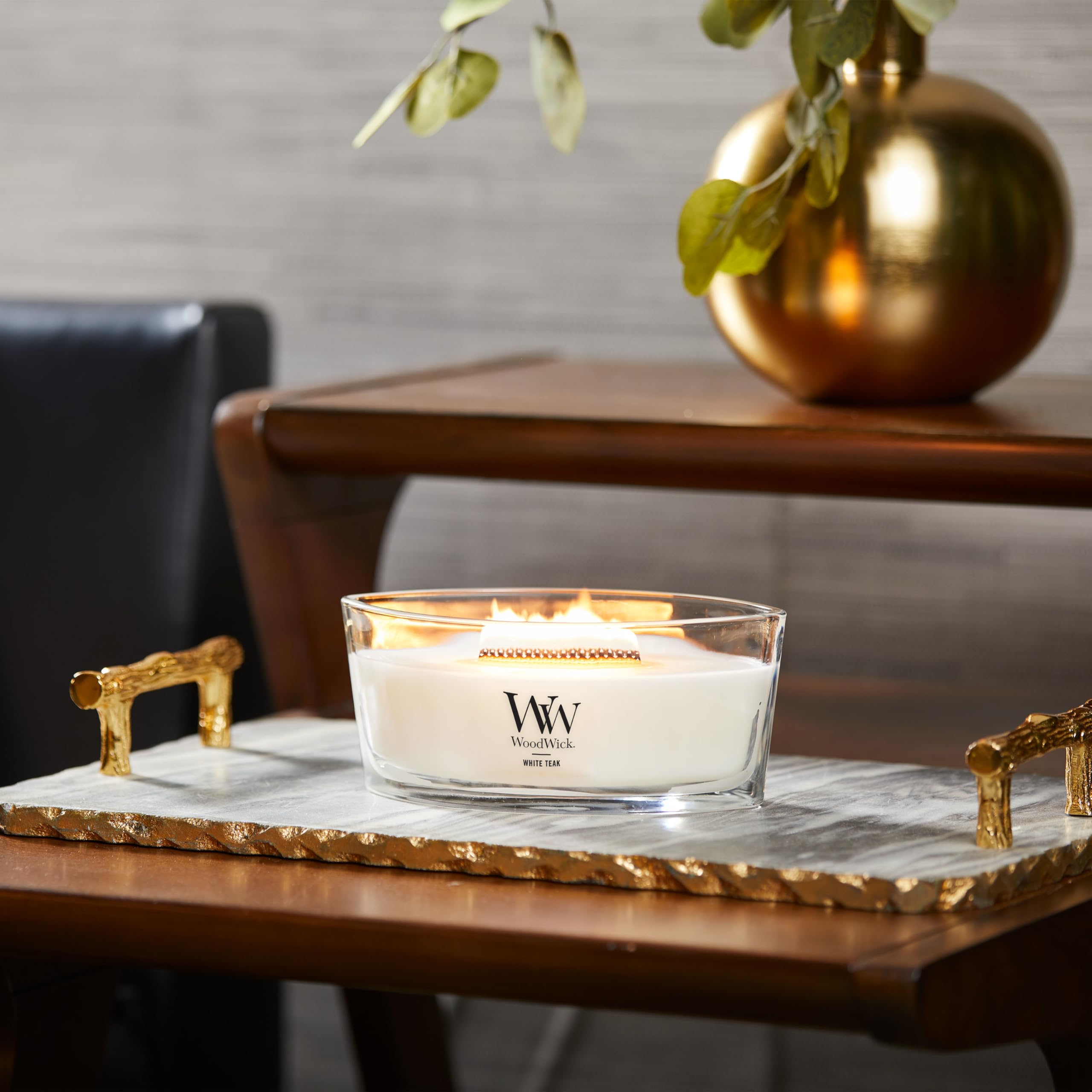 Ellipse opening showing wide melt pool on WoodWick candle.