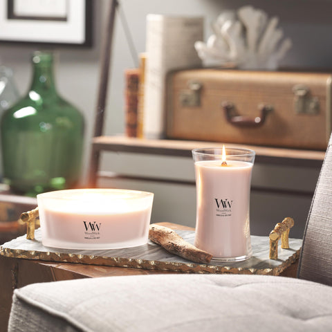 WoodWick Vanilla Sea Salt lit candle creates warm, inviting atmosphere.