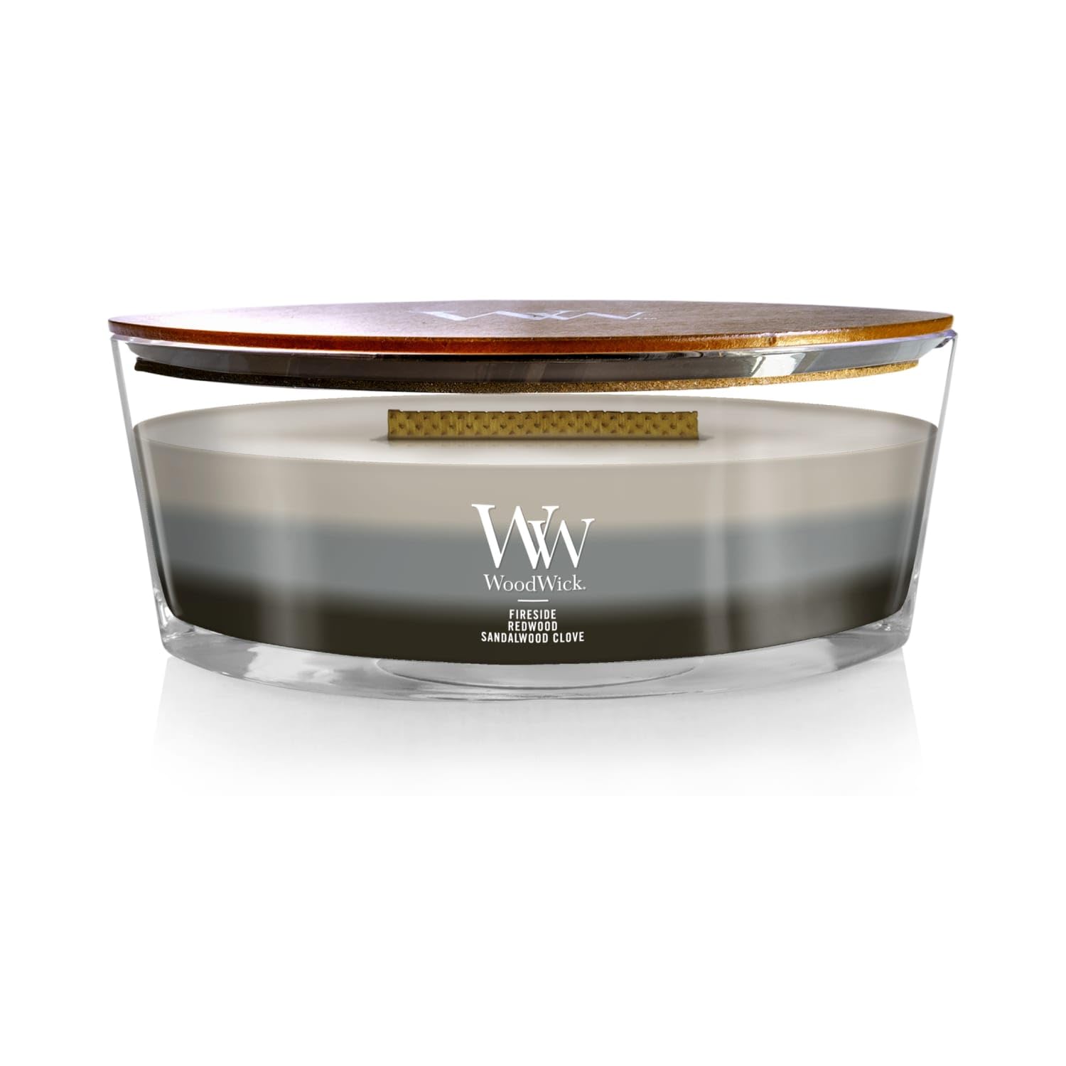 WoodWick Warm Woods Trilogy fireside ellipse showcases a warm glow for inviting evenings