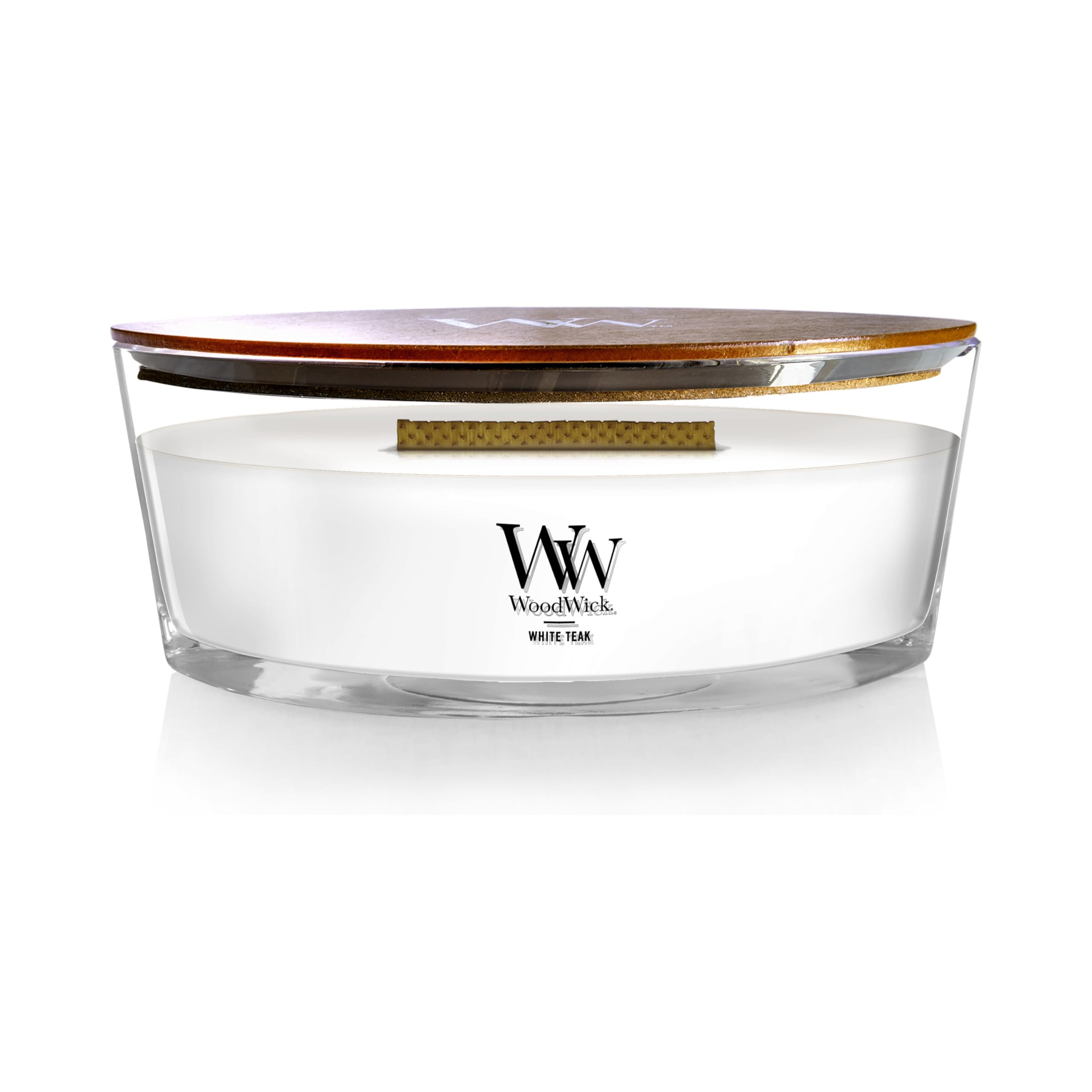 WoodWick White Teak ellipse candle with warm glow for cozy evenings.