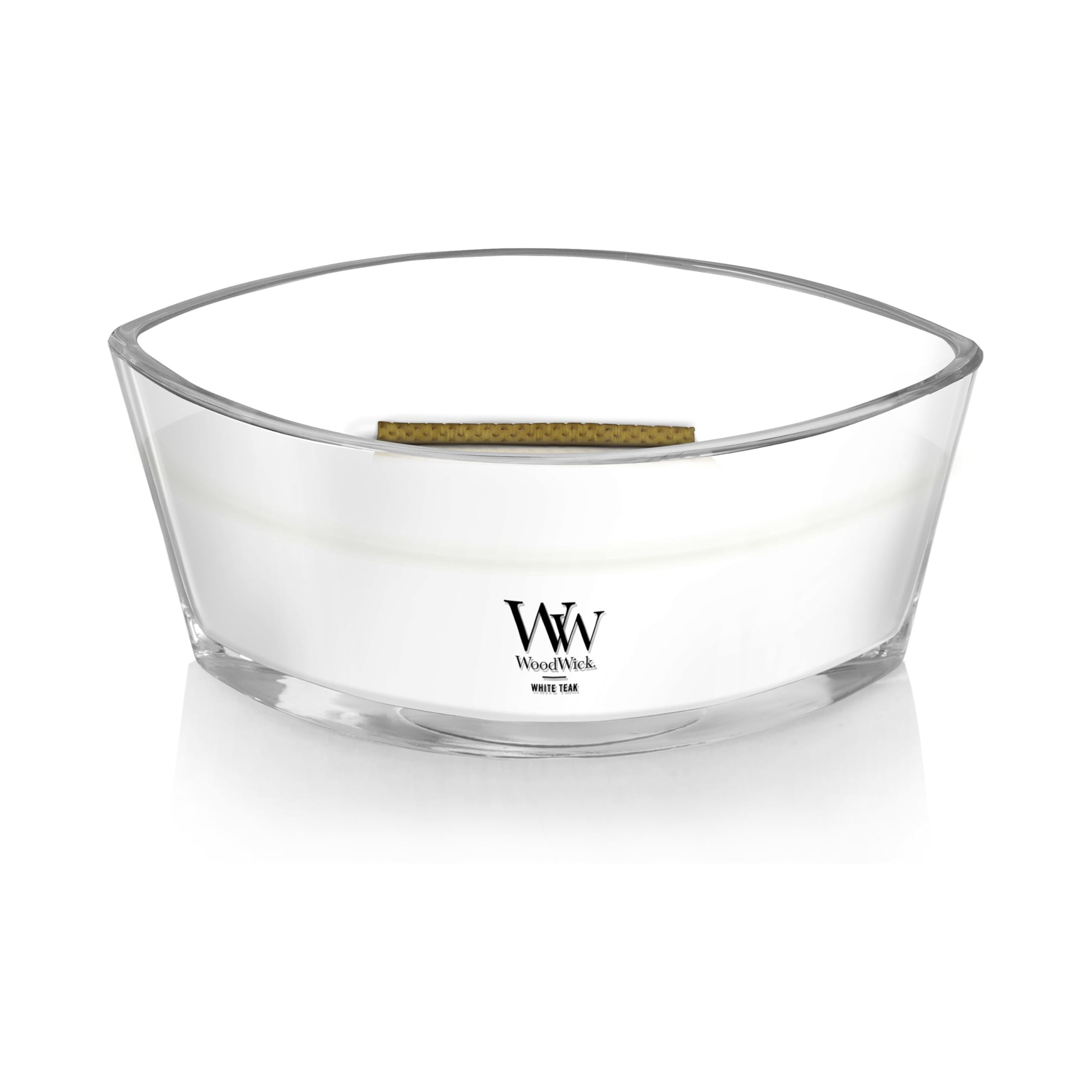 WoodWick White Teak candle with visible wax pool.