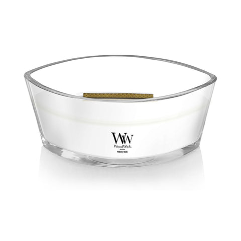 WoodWick White Teak candle with visible wax pool.
