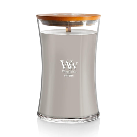 WoodWick Wood Smoke Hourglass Candle glowing warmly for cozy ambiance