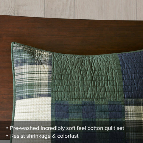 Woolrich Mill Creek bed setup in a cozy cabin ambiance