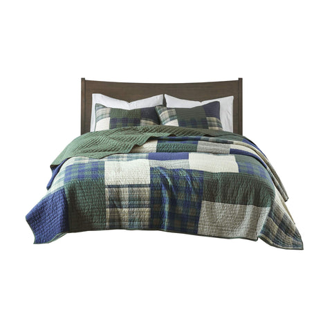 Woolrich Mill Creek quilt draped over a bed for visual appeal