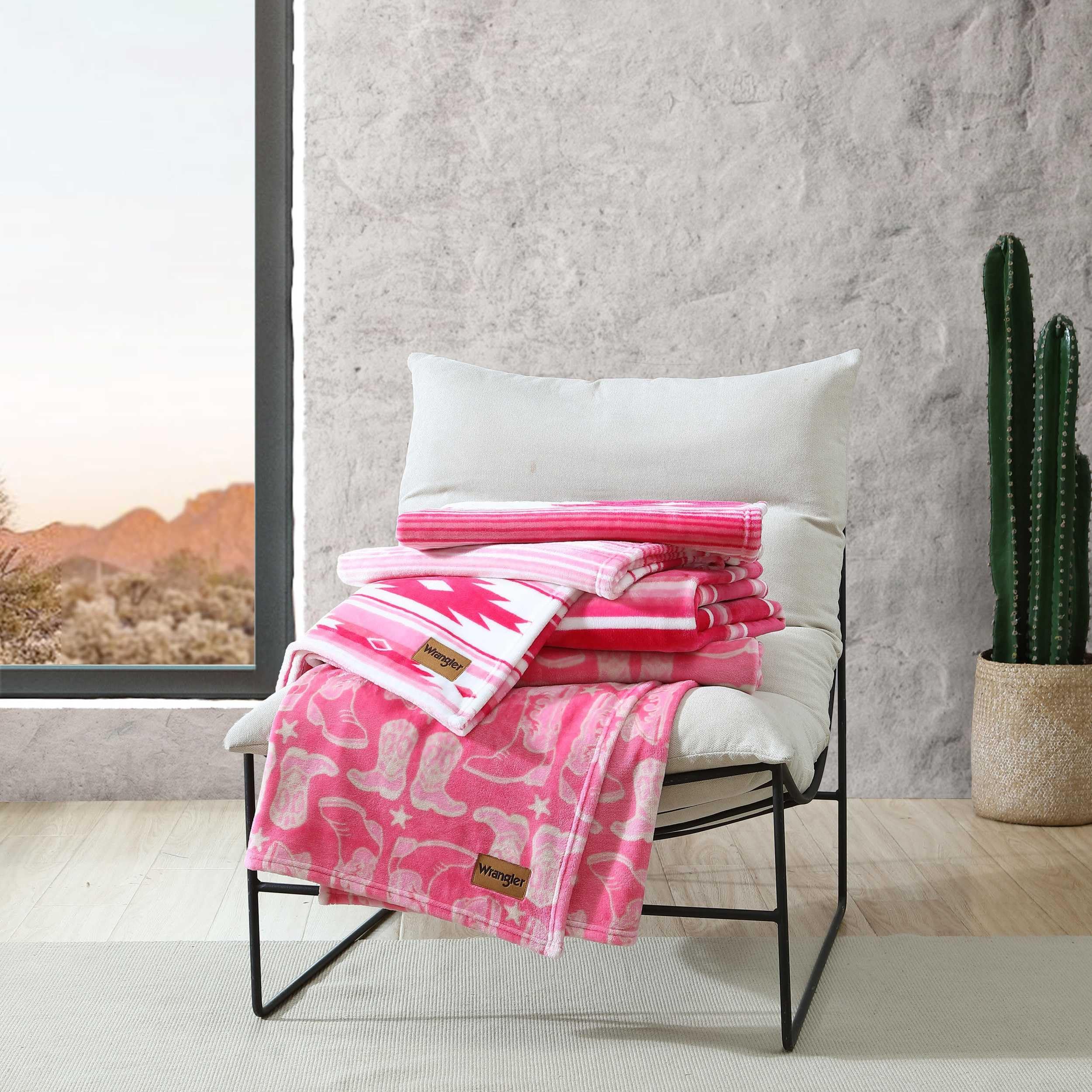 Wrangler blanket folded on display, 50x60 inches for versatile warmth.
