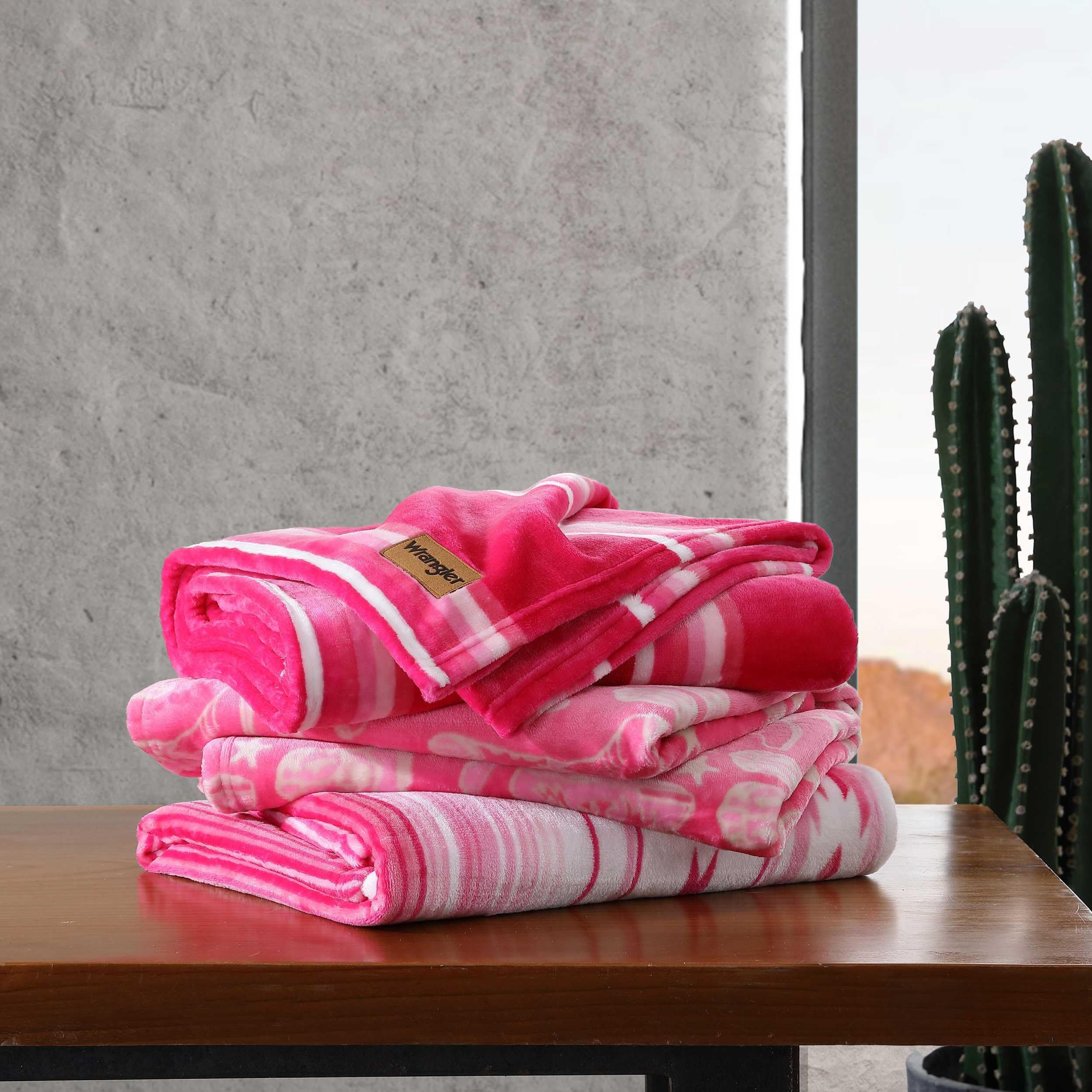 Wrangler blanket placed on a couch for warm, casual comfort.