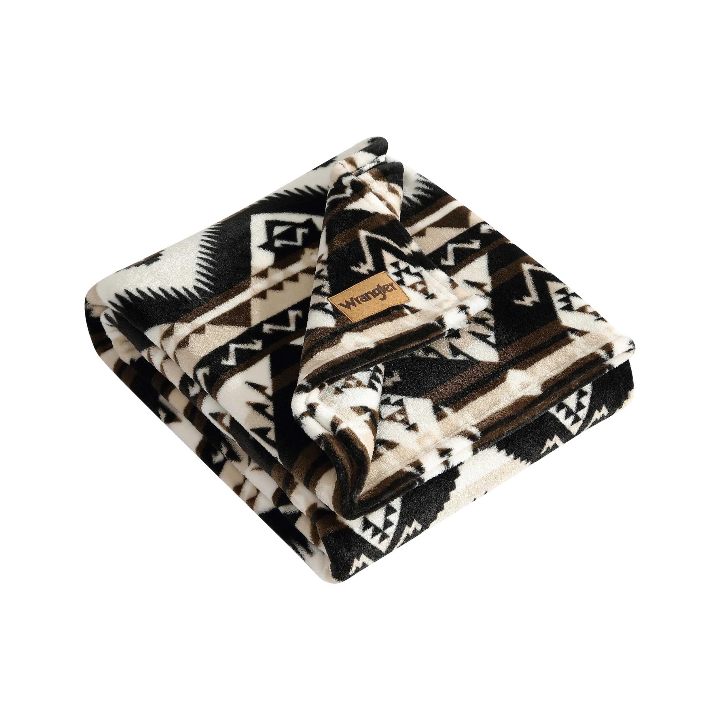 Wrangler Sherpa throw blanket on sofa showing 50x60 size for cozy lounging