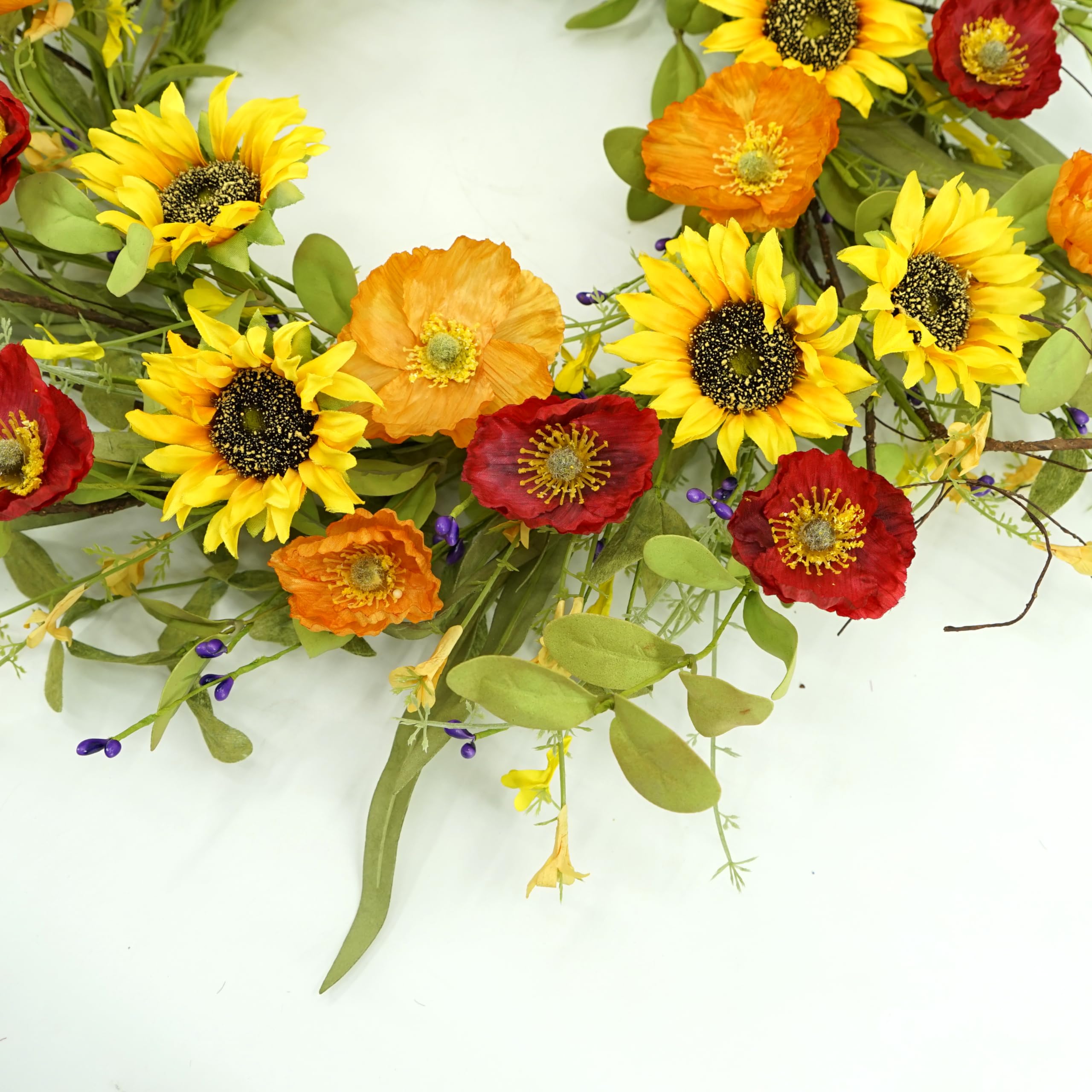 WreathDream green leaves and poppy accents for a fresh seasonal look.