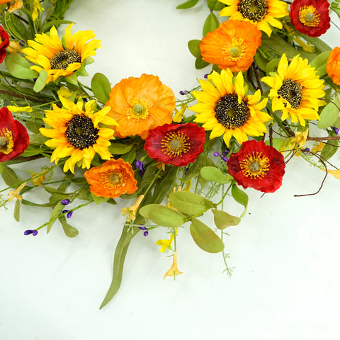 WreathDream green leaves and poppy accents for a fresh seasonal look.