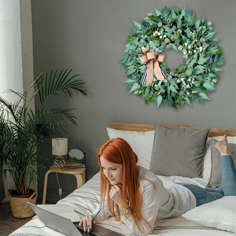 WREATHOME greenery wreath on wall provides stylish all-season decor.