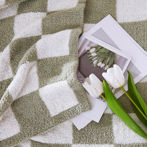 WRENSONGE checkered throw folded neatly for display