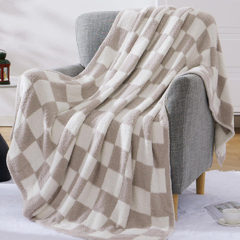 WRENSONGE checkered throw blanket in travel bag showing compact design